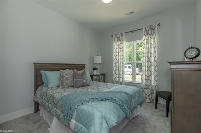 bedroom featuring carpet flooring, baseboards, and visible vents