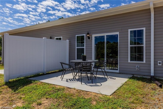 view of patio / terrace featuring fence