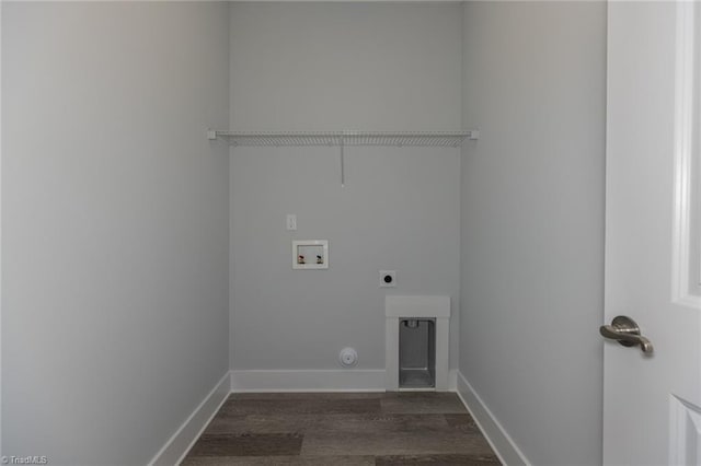 clothes washing area with dark wood-type flooring, baseboards, laundry area, hookup for a washing machine, and hookup for an electric dryer