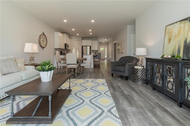 living area featuring recessed lighting and wood finished floors