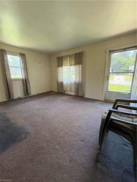 1611 Willow Rd, Greensboro, NC 27401 - unfurnished living room featuring carpet floors