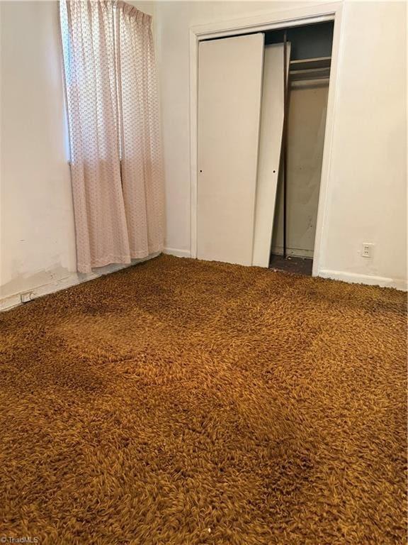 1611 Willow Rd, Greensboro, NC 27401 - unfurnished bedroom with a closet and carpet floors