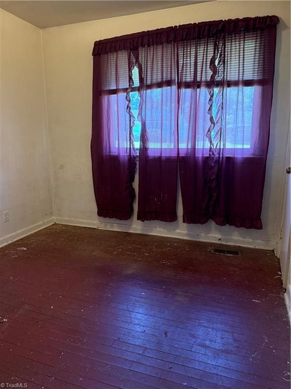1611 Willow Rd, Greensboro, NC 27401 - spare room with plenty of natural light and wood-type flooring