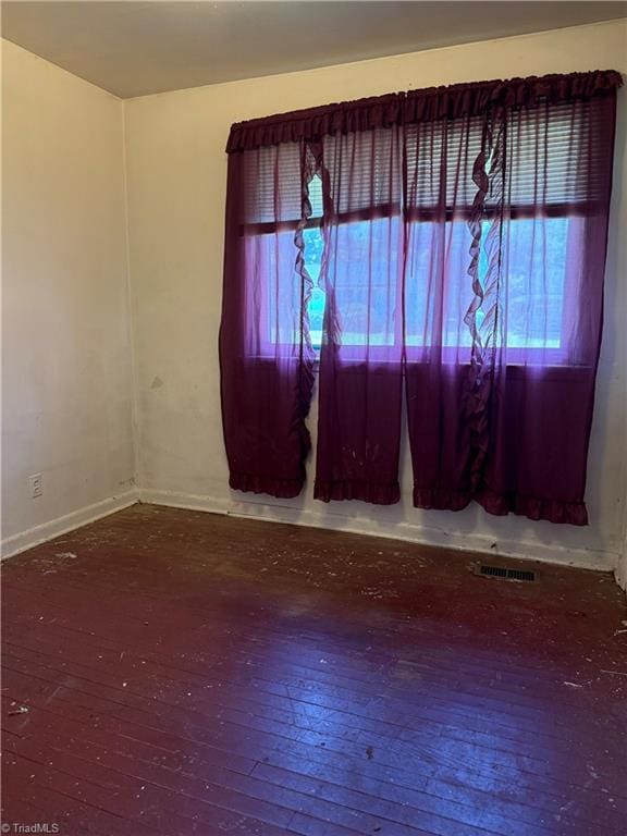 1611 Willow Rd, Greensboro, NC 27401 - unfurnished room with healthy amount of natural light and hardwood / wood-style flooring