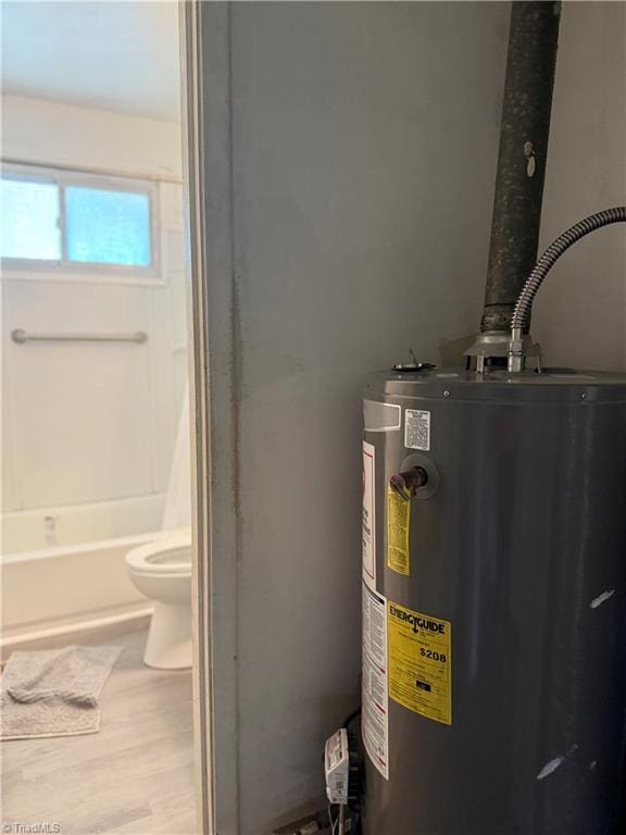 1611 Willow Rd, Greensboro, NC 27401 - utility room featuring water heater