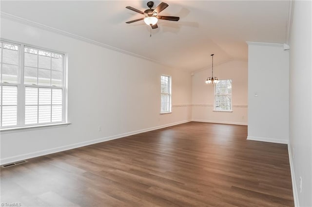 unfurnished room with ceiling fan with notable chandelier, lofted ceiling, crown molding, and dark wood-type flooring