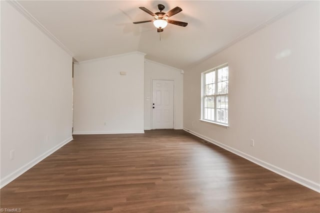 spare room featuring ceiling fan, dark hardwood / wood-style flooring, crown molding, and vaulted ceiling