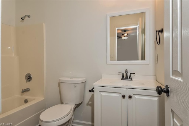 full bathroom featuring vanity, ceiling fan, toilet, and washtub / shower combination