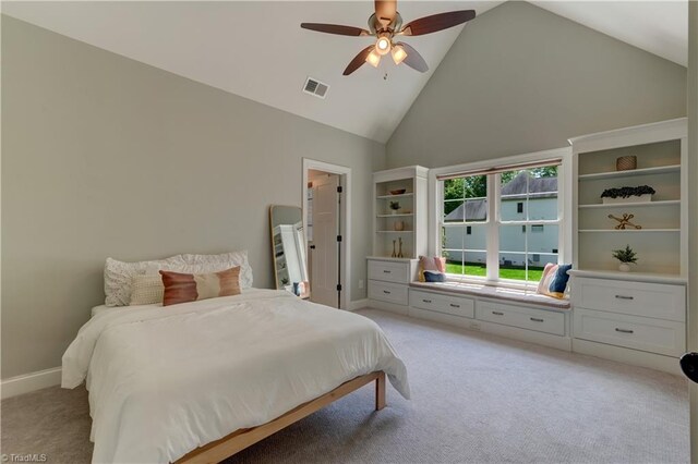 bedroom with light carpet, high vaulted ceiling, baseboards, and a ceiling fan