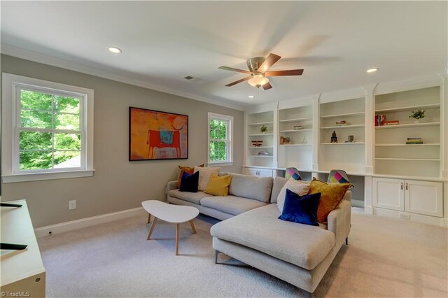 living area featuring ornamental molding, light carpet, a ceiling fan, recessed lighting, and baseboards