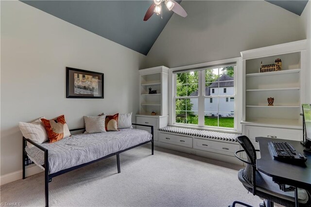 home office with a ceiling fan, light carpet, high vaulted ceiling, and baseboards