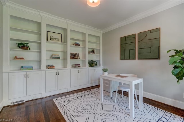 home office with dark wood-type flooring, ornamental molding, baseboards, and built in features