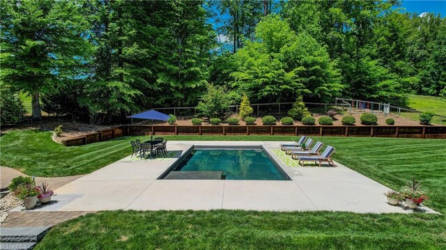 view of pool featuring a patio area