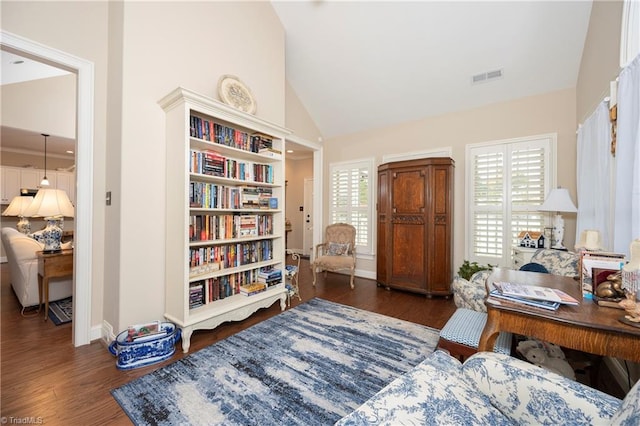 office with high vaulted ceiling and dark hardwood / wood-style floors