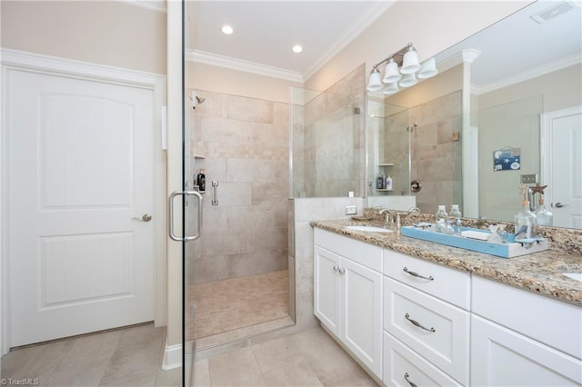 bathroom with an enclosed shower, vanity, tile patterned floors, and ornamental molding