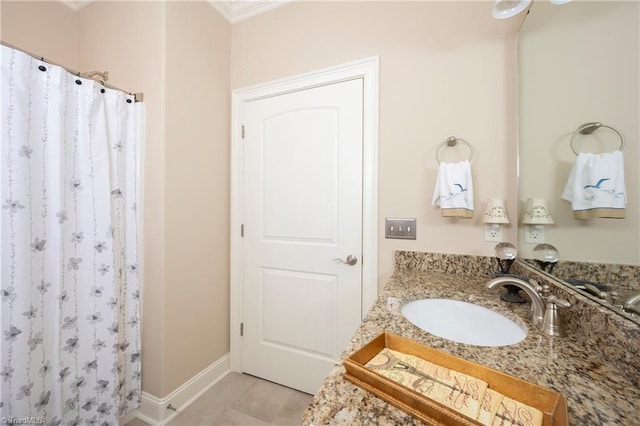 bathroom featuring vanity and curtained shower