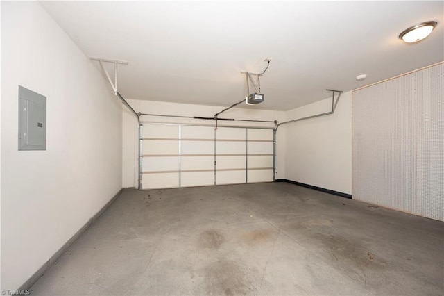 garage featuring electric panel and a garage door opener