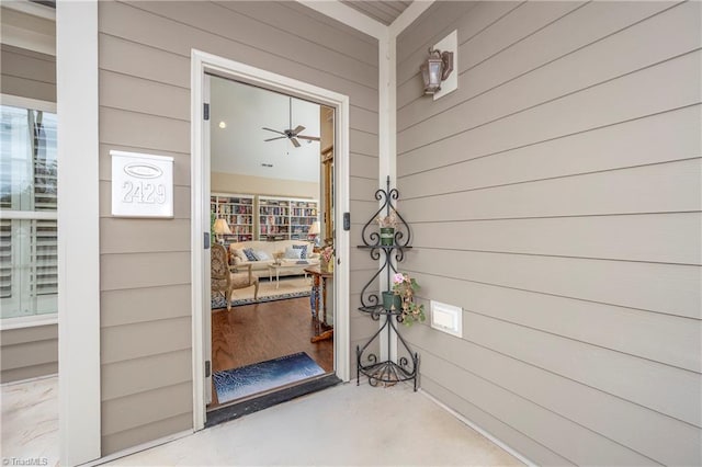 property entrance with ceiling fan