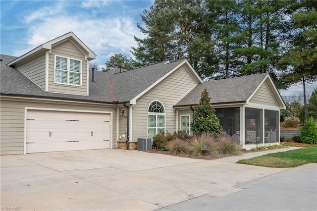 view of front of house featuring central AC and a sunroom