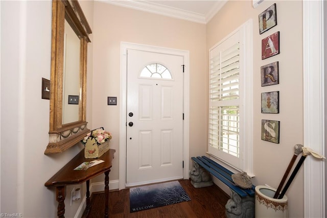 foyer entrance featuring ornamental molding and dark hardwood / wood-style floors