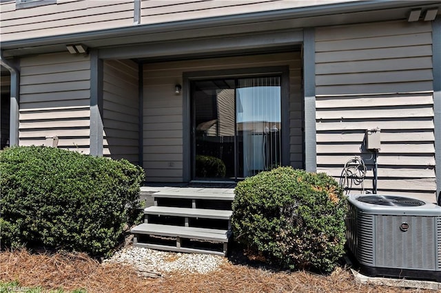 view of exterior entry with central AC unit