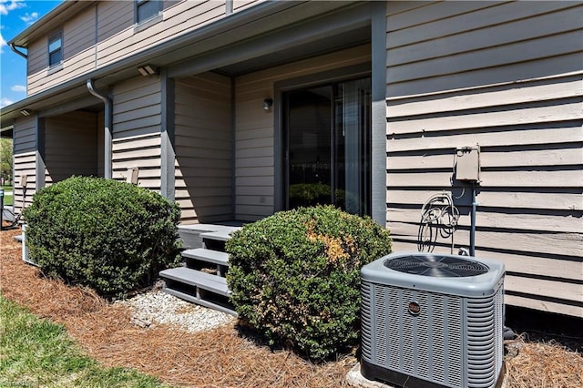 view of exterior entry with central AC