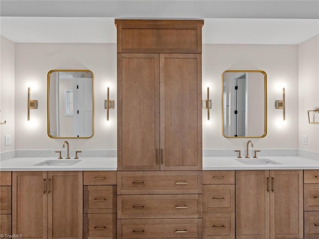 bathroom with double vanity and a sink