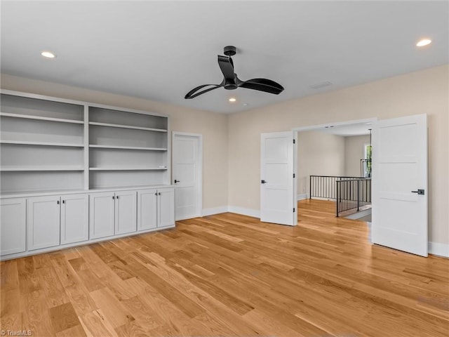 interior space featuring light wood-style floors, recessed lighting, and baseboards