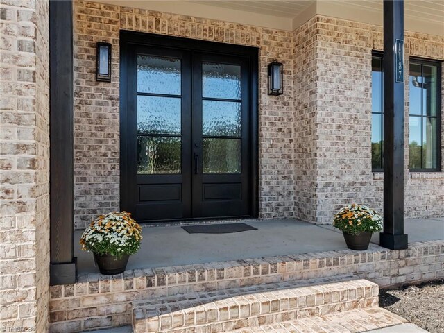 entrance foyer featuring light hardwood / wood-style flooring and french doors