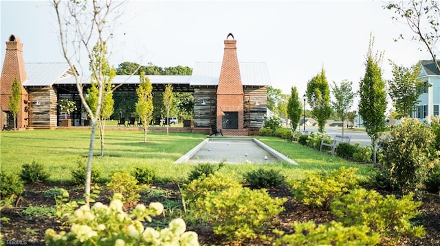 view of home's community with a yard