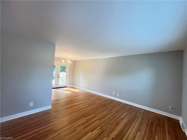 100 Petree Rd, Winston-Salem, NC 27106 - unfurnished room with a chandelier, dark wood finished floors, and french doors
