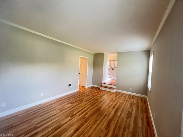 100 Petree Rd, Winston-Salem, NC 27106 - spare room with wood finished floors, ornamental molding, and stairway