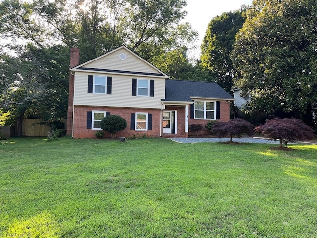 100 Petree Rd, Winston-Salem, NC 27106 - tri-level home with brick siding and a chimney