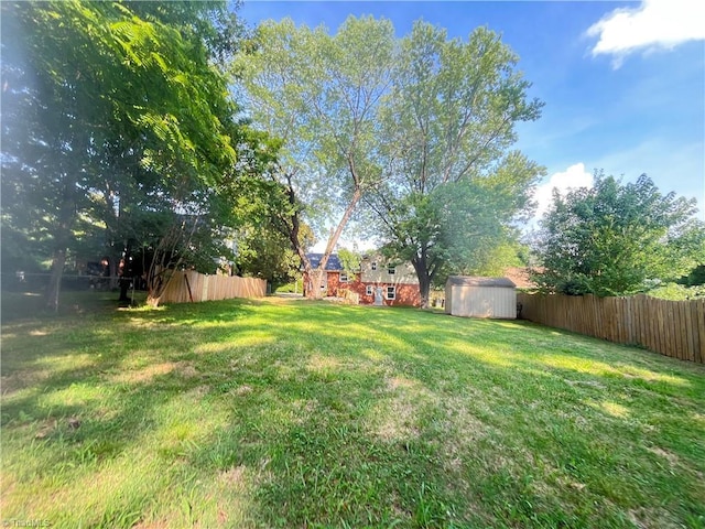 100 Petree Rd, Winston-Salem, NC 27106 - fenced backyard with a storage unit