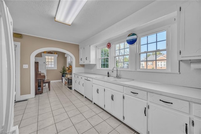 1109 Wildwood Rd NE, Lenoir, NC 28645 - kitchen with a sink, a textured ceiling, white appliances, healthy amount of natural light, and white cabinets
