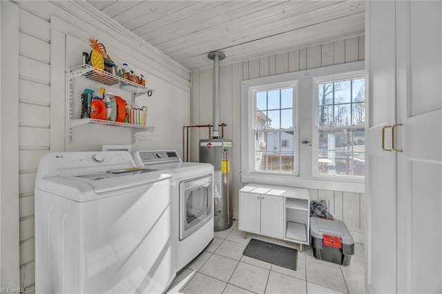 1109 Wildwood Rd NE, Lenoir, NC 28645 - laundry area featuring water heater, separate washer and dryer, and light tile patterned flooring
