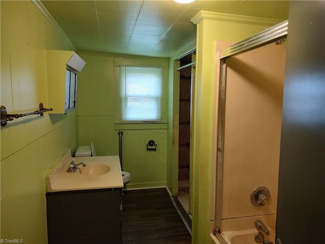 full bathroom featuring vanity, hardwood / wood-style flooring, toilet, and  shower combination