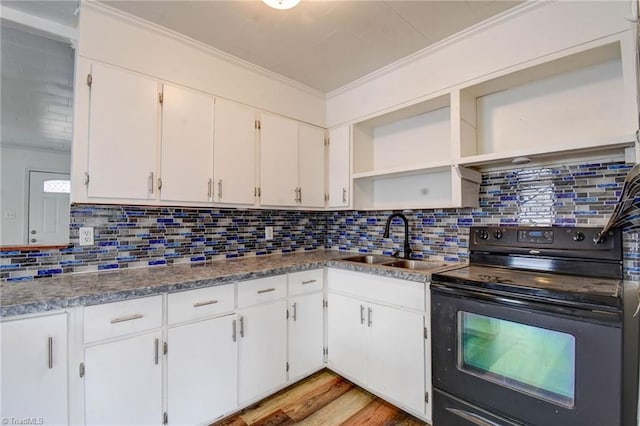 kitchen featuring white cabinetry, black range with electric stovetop, sink, and crown molding