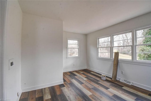 unfurnished room featuring dark hardwood / wood-style flooring