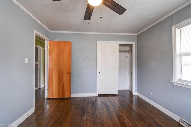 unfurnished bedroom with crown molding, ceiling fan, and dark hardwood / wood-style flooring