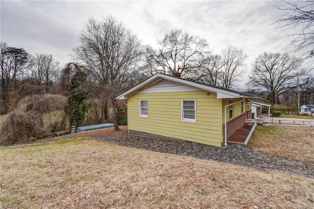 view of property exterior featuring a yard