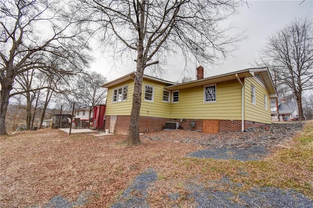 view of home's exterior with cooling unit