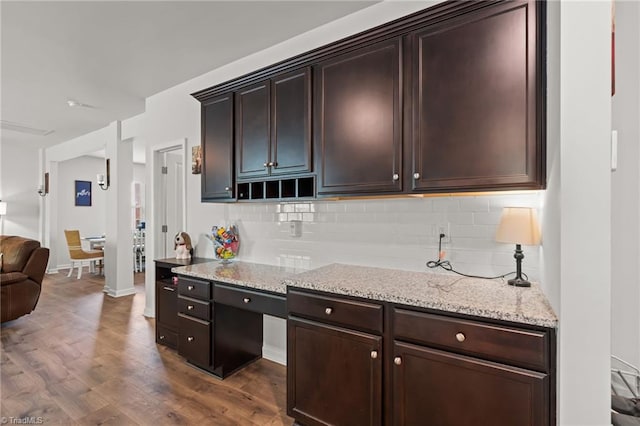 371 Royce Dr, Winston-Salem, NC 27107 - kitchen with dark wood-style flooring, light stone countertops, decorative backsplash, and dark brown cabinets