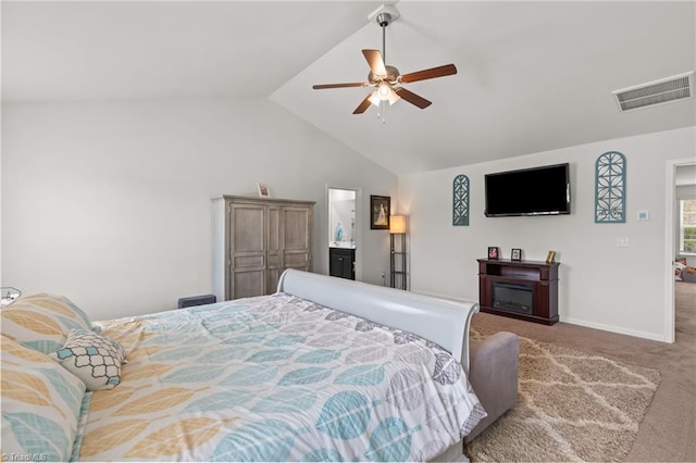 371 Royce Dr, Winston-Salem, NC 27107 - bedroom featuring carpet flooring, a glass covered fireplace, baseboards, vaulted ceiling, and visible vents