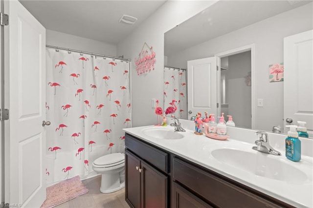 371 Royce Dr, Winston-Salem, NC 27107 - full bath featuring a sink, toilet, double vanity, and visible vents