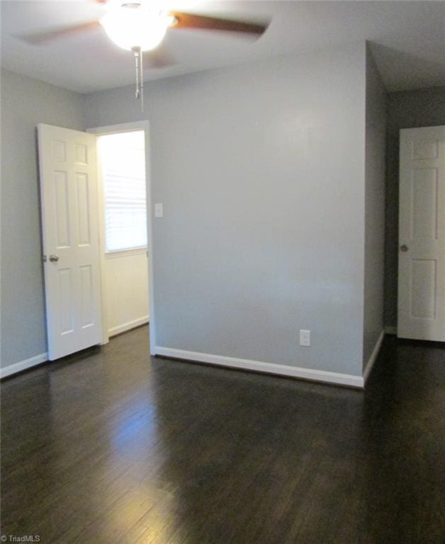 4503 Radnor Dr, Greensboro, NC 27410 - unfurnished room with a ceiling fan, baseboards, and dark wood-style flooring
