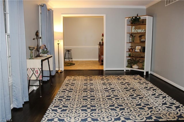 4503 Radnor Dr, Greensboro, NC 27410 - hall with wood finished floors, crown molding, and baseboards
