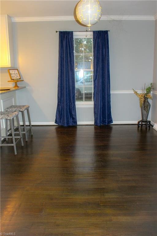 4503 Radnor Dr, Greensboro, NC 27410 - dining room featuring ornamental molding, wood finished floors, and baseboards