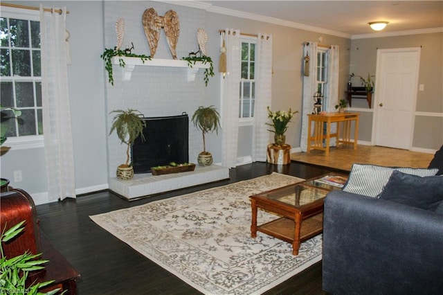 4503 Radnor Dr, Greensboro, NC 27410 - living room featuring wood finished floors, baseboards, plenty of natural light, crown molding, and a brick fireplace
