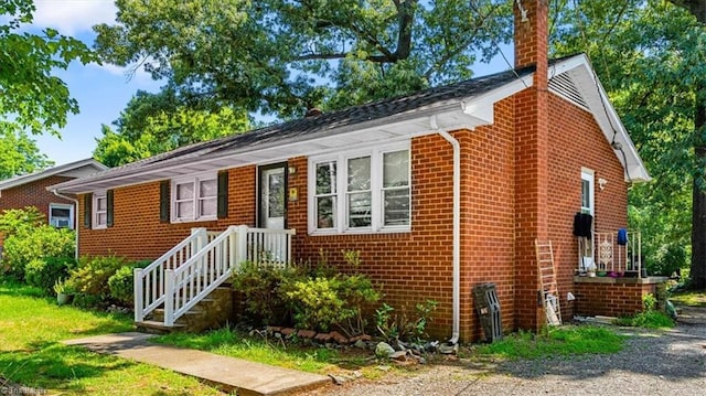803 Buckner St, Graham, NC 27253 - view of front facade with brick siding and a chimney